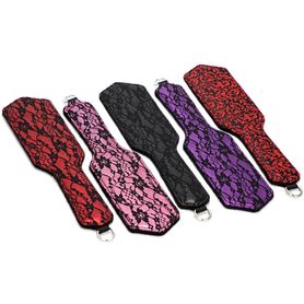 BDSM spanking paddle, black and red color, lace, floral pattern