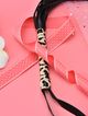 BDSM leather black whip, straps and handle with leopard pattern