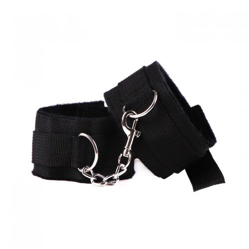 Handcuffs, hairy black fur and straps
