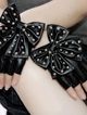 Black leather gloves without fingers, studs and bow
